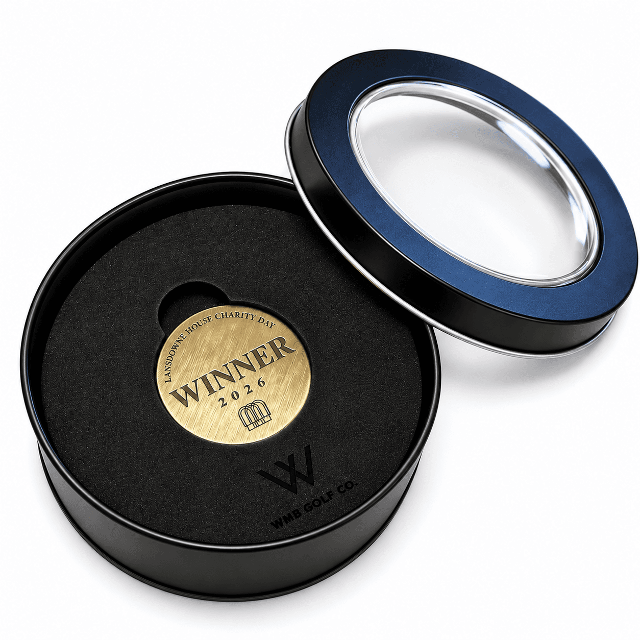 Brass Lansdowne House Charity Day Winner 2026 ball marker in a black WMB Golf Co. presentation tin