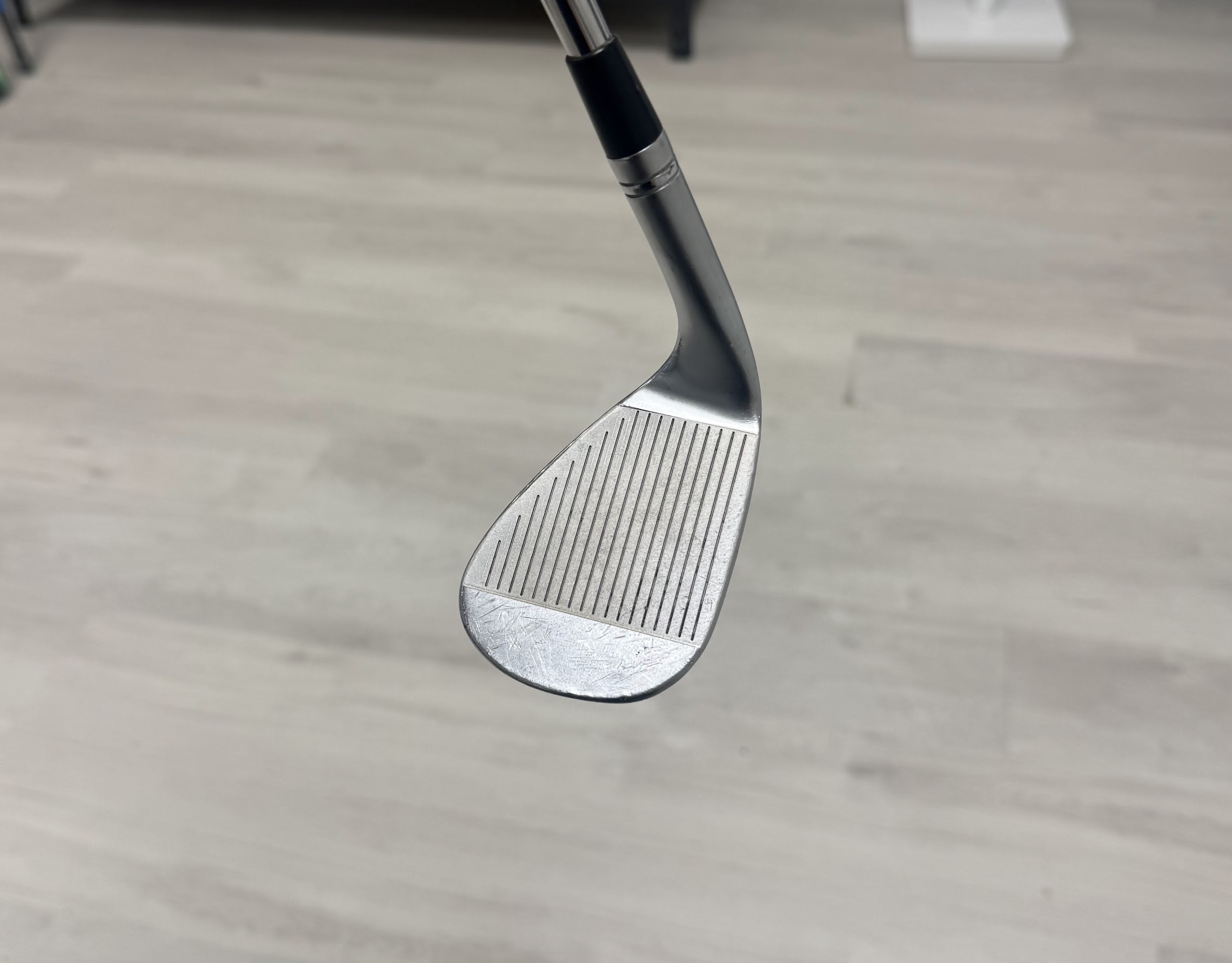 Restored golf club face after refurbishment